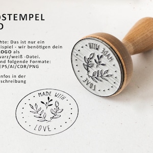 May include: A wooden stamp with a round, silver-colored base. The base has a design of leaves and the words "Made With Love". The stamp is used for creating custom logos.