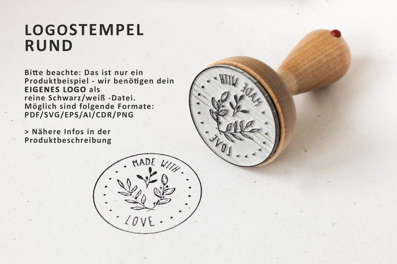 May include: A wooden stamp with a round, silver-colored base. The base has a design of leaves and the words "Made With Love". The stamp is used for creating custom logos.