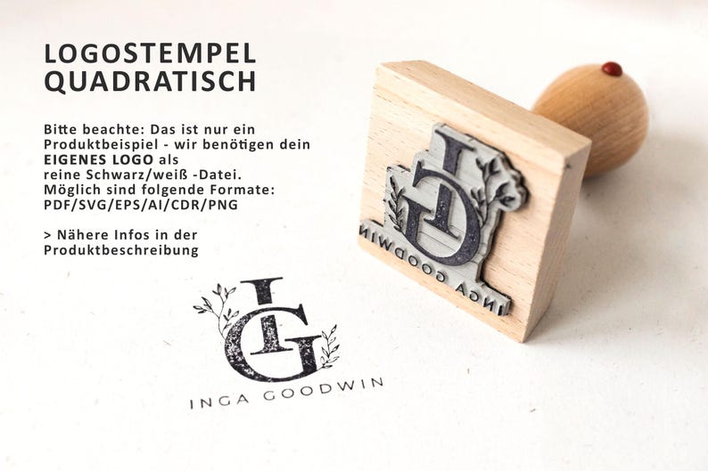 May include: A wooden square stamp with a black and white design of the letters "IG" with floral accents. The text "INGA GOODWIN" is printed on the stamp. The stamp is on a white surface.