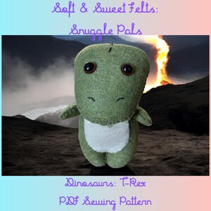 May include: A green felt dinosaur plush toy with large, dark eyes and a white belly. The text "Soft & Sweet Felts: Snuggle Pals" and "Dinosaurs: T-Rex PDF Sewing Pattern" are visible. The background shows a volcanic landscape.