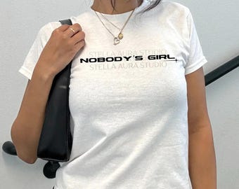 Tate McRae Nobody’s Girl Baby Tee, Y2K Graphic Shirt, Trendy Streetwear Top