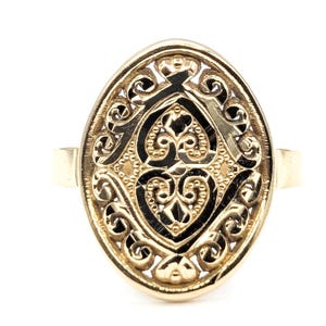 May include: A white ceramic mug with a black handle and the text "But First, Coffee" in a bold, black font. The mug is set against a blurred background, highlighting its clean design. The mug appears to be approximately 4 inches tall.