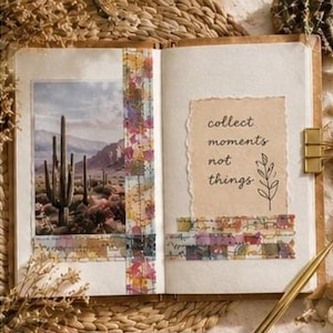 May include: An open journal featuring a photograph of a desert landscape with saguaro cacti on the left page and a tan paper insert on the right page with the text "collect moments not things" and a line drawing of a plant, decorated with patterned tape.
