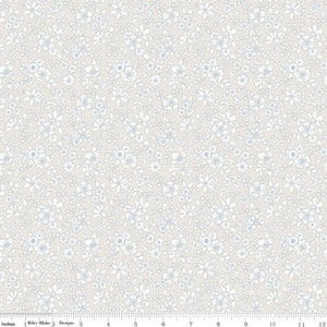 May include: A white background with a repeating pattern of small blue and white flowers.