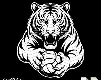 May include: A black and white illustration of a tiger with an aggressive expression, holding a basketball in its claws. The tiger's stripes and facial features are detailed. The image includes the text "Crafted Creations", and SVG and PNG file type icons.