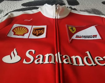 Chaqueta auténtica del equipo Ferrari de Fórmula 1 – Colección Vintage oficial de la Scuderia F1 – Chaqueta de carreras Puma Santander Shell UPS (talla L)