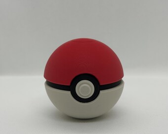 May include: A red and white Poké Ball with a black band and a central button. The top half is red, the bottom half is white, and the button is black with a white center. A classic design.