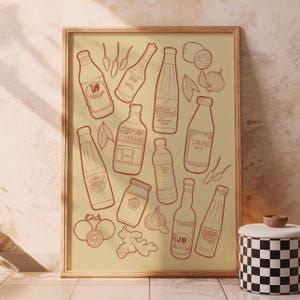 May include: A framed print featuring line art illustrations of various bottles, condiments, and ingredients. The artwork includes bottles labeled "Silver Swan", "Mang Tomas", "Fish Sauce JB", and "Lorins Patis", along with ginger, garlic, and tomatoes.