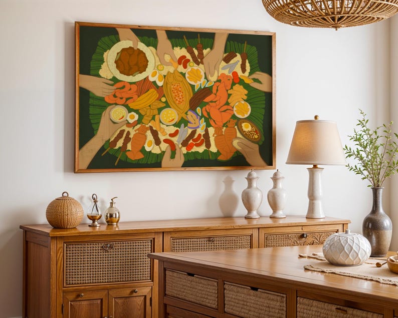 May include: A framed artwork depicting a colorful array of food items, including fruits, meats, and sauces, arranged on a green leaf. The artwork features multiple hands reaching towards the food. The frame is a warm brown color, and the artwork is displayed on a white wall.