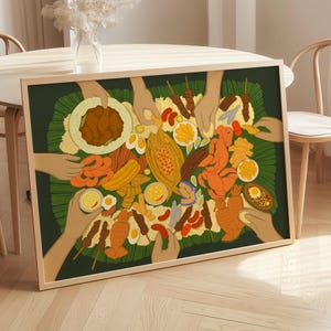 May include: A framed art print depicting a colorful illustration of a shared meal. The artwork features various dishes, including skewers, eggs, and fruit, arranged on a green leaf. Hands reach in to serve themselves, creating a sense of community and sharing.