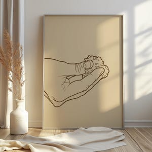 May include: A line drawing of a hand holding a small cluster of rice.