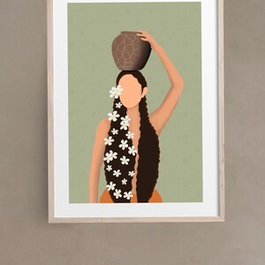 May include: Art print of a woman with long dark hair, adorned with white flowers, carrying a brown pot on her head. The artwork is set against a light green background with a subtle pattern, framed in a light wood frame.