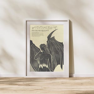 May include: A framed art print featuring a stylized illustration of a winged figure. The artwork is in grayscale with a vintage aesthetic. Text at the top reads "ma-na-na-ng-g-a-l". The figure has long hair and is partially nude.