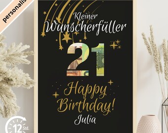 May include: A framed black birthday print with gold lettering and accents. The number "21" is filled with images of currency. The text reads "Kleiner Wunscherfüller", "Happy Birthday!" and "Julia".