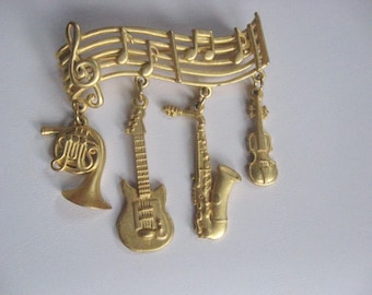 Gold Tone Musical Pin Signed JJ / Music Bar with Horn, Guitar, Saxophone and Violin