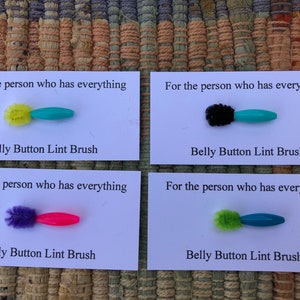 4 belly button lint brushes - for the person who has everything