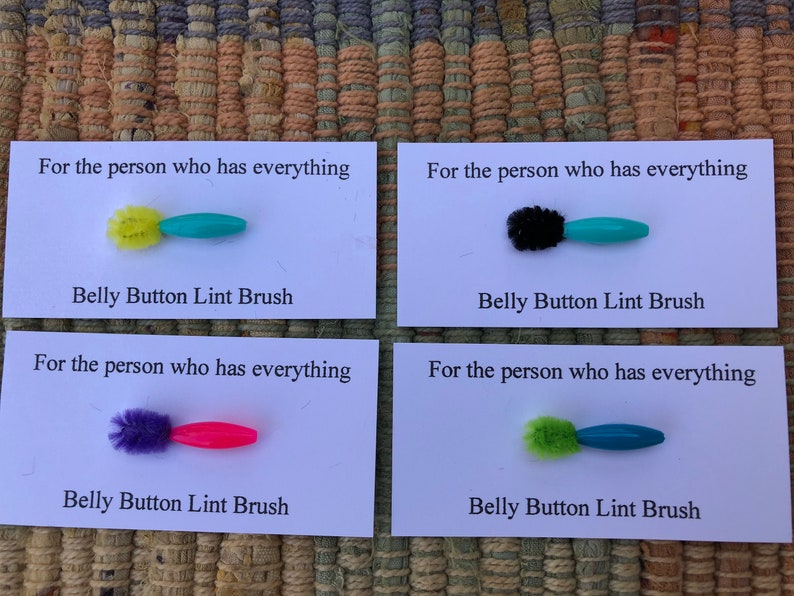 4 belly button lint brushes for the person who has everything image 1