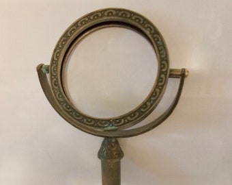 Round Brass Picture Or Mirror Frame On Stand Vintage Has Patina And Wear Tabletop