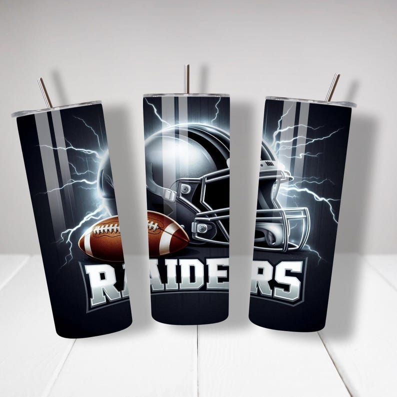May include: Three black and silver tumblers featuring a football helmet and football design. The tumblers have the word "RAIDERS" printed on them.