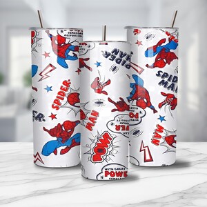 May include: Three white insulated tumblers with a repeating pattern of the Spider-Man comic book character in red and blue. The design includes comic book speech bubbles, stars, and lightning bolts. Each tumbler has a straw.