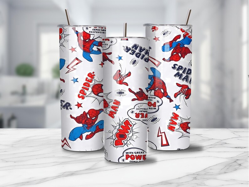 May include: Three white insulated tumblers with a repeating pattern of the Spider-Man comic book character in red and blue. The design includes comic book speech bubbles, stars, and lightning bolts. Each tumbler has a straw.