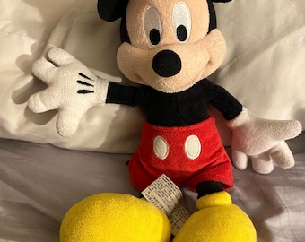 Micky Mouse doll.  A loved doll looking for a new home. Micky is clean and in great condition. Disney Parks original Mickey Mouse /12inches.
