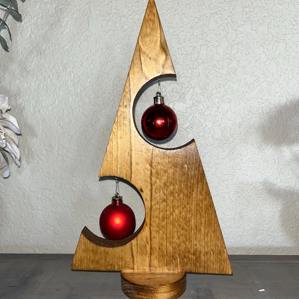 Handmade rustic wooden Christmas tree decor with ornaments