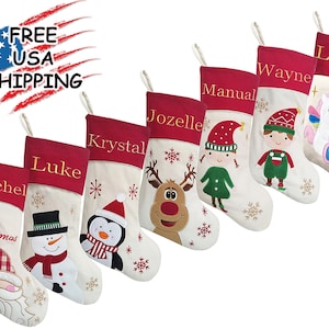 May include: Set of ten personalised Christmas stockings with various embroidered designs, including a reindeer, snowman, penguin, and a Christmas tree. The stockings are made of white felt with red felt cuffs and are personalised with names like Rachel, Luke, Krystal, Jozelle, Manual, Wayne, and Luke.