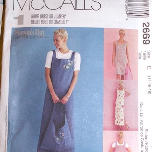 May include: McCall's sewing pattern for a dress or jumper. The pattern features a woman wearing a denim jumper with floral embroidery, and other dress styles. The pattern size is E (14-16-18).