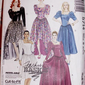 May include: McCall's sewing pattern featuring illustrations of five different formal dresses. The dresses have square necklines, puffed sleeves, and full skirts. The pattern includes the text "Fashion Basic" and "Petite-Able".