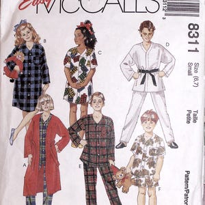 May include: McCall's sewing pattern for children's sleepwear. The designs include pyjamas, robes, and a karate-style outfit. The cover shows illustrations of the finished garments, with sizes for small (6,7).
