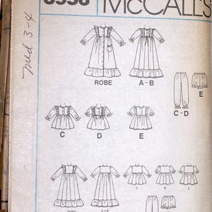May include: A vintage McCall's sewing pattern, number 3956, featuring illustrations of a robe, nightgowns, and pants. The pattern includes various styles with ruffled details and different sleeve lengths. The size is marked as med 3-4.