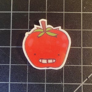 Adesivo lucido con testa di mela sorridente