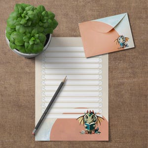 Cancelleria "Drago con libro" - Carta intestata e busta fai da te in 4 righe