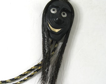 Vintage Bolo Tie Shrunken Head Comic Art, Smiling Face With Long Black Horsehair Hair, Satirical Humorous Voodoo