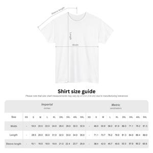 May include: A white t-shirt with measurements labeled for width, length, and sleeve length. The image includes a shirt size guide with measurements in inches and centimeters. The guide shows sizes from XS to 5XL.