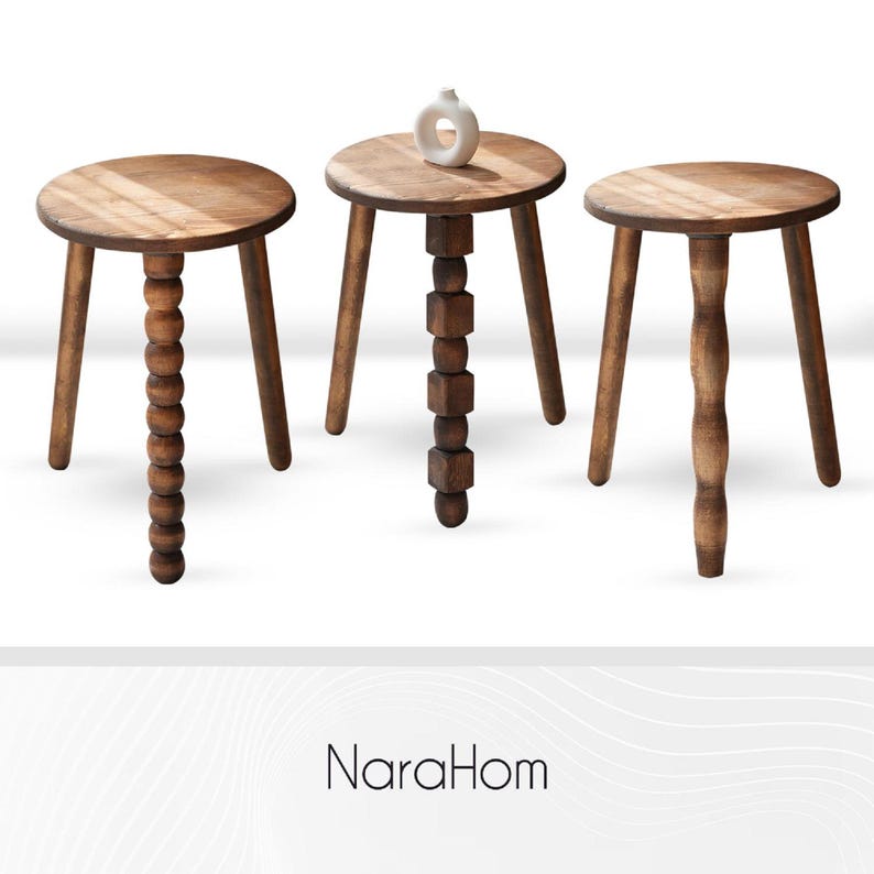 May include: Three wooden stools with round tops and three legs. The stool on the left has a beaded leg, the stool in the middle has a leg made of stacked wooden blocks, and the stool on the right has a leg with a wavy design.