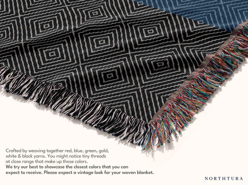 May include: Woven blanket with a geometric diamond pattern in black and white. The blanket has a fringed edge with red, blue, green, and gold threads. The text on the image says, "Crafted by weaving together red, blue, green, gold, white & black yarns."