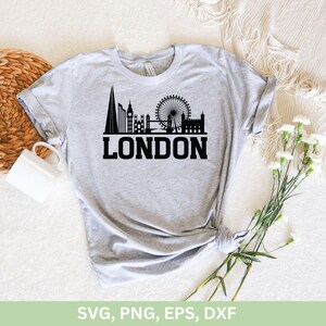May include: A gray t-shirt with a black silhouette of the London skyline, including Big Ben, the London Eye, and Tower Bridge. The text "LONDON" is printed below the skyline.
