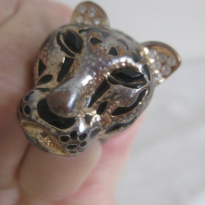 Tiger head ring, antique gold, clear and black rhinestones and black enamel spots. 15 mm diameter  ring opening. Vintage