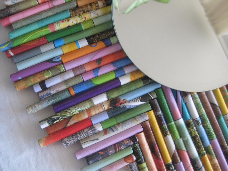 Round mirror surrounded by a collage of colorful upcycled Etsy