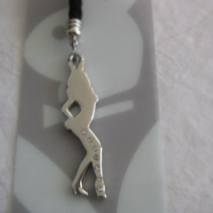 Playboy phone strap/keychain charm, a silver lady silouhet with clear rhinstones. Great collectible item.