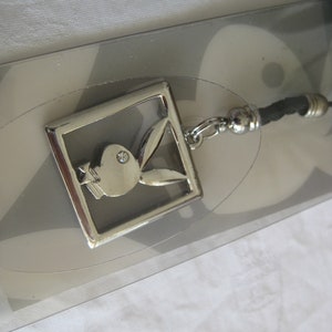 Playboy phone strap/keychain, silver bunny in a silver frame, 1&quot; x 1&quot;, party favors for adults, bachelor/bachelorette parties...