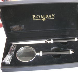A vintage desk set of letter opener and magnifier/pen, by Bombay, in a velvet lined box. New, never used. To keep or to gift.