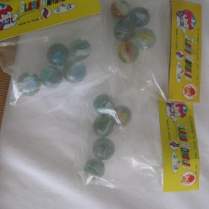 Rare vintage marbles, in original factory bag, new/old stock, 10 multicolor cat eye marbles, add to collection, start a collection.