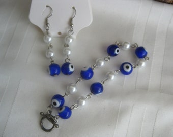 Evil eye beads ( choose from 7 colors) w faux white pearly beads, set of earrings and bracelet. Hand made. Choose your color/s