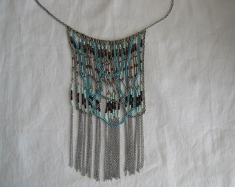 Vintage necklace, seed beads silver tone and turquoise chains makes this a unique bib style necklace. 23" chain + 7" cascading hand made bib