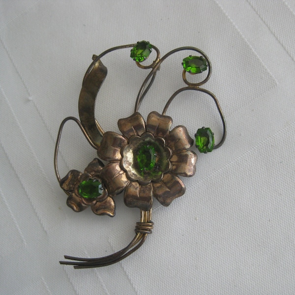 Vintage brooch, flower w emerald green peridot stones, bronze color petals, 3.5" x 2". Harry Iskin piece, Stamped on the back
