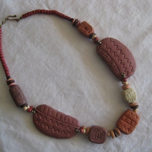 Vintage, clay/ceramic carved beads necklace, earthy colors, very unique, tribal, native, African jewelry. 19&quot;