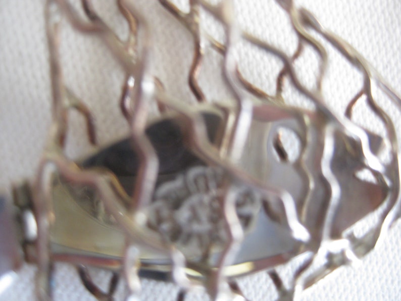 unique vintage piece of jewelry Fish in the net silver pendant movable tail 1.5 x 2.